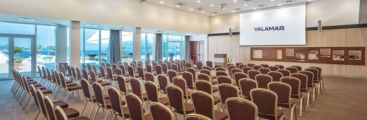 a room with rows of chairs